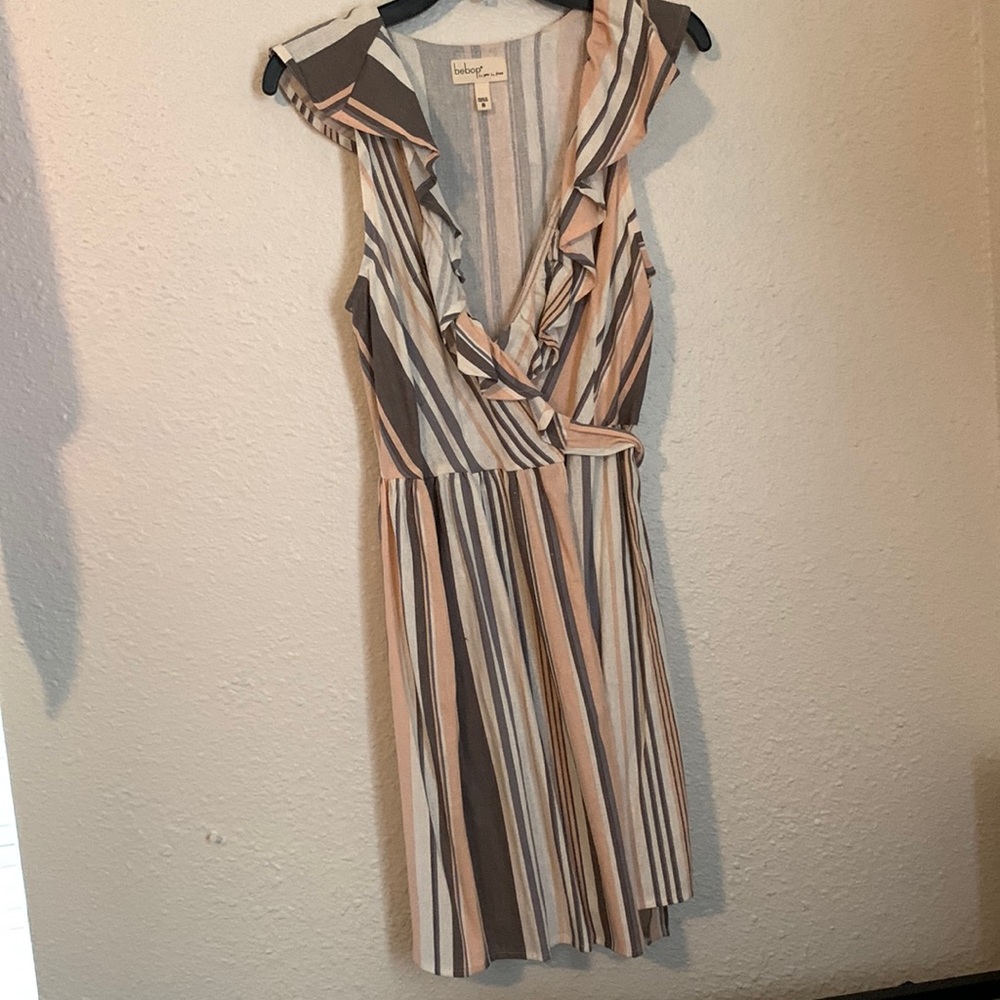 Knee length, wrap dress.